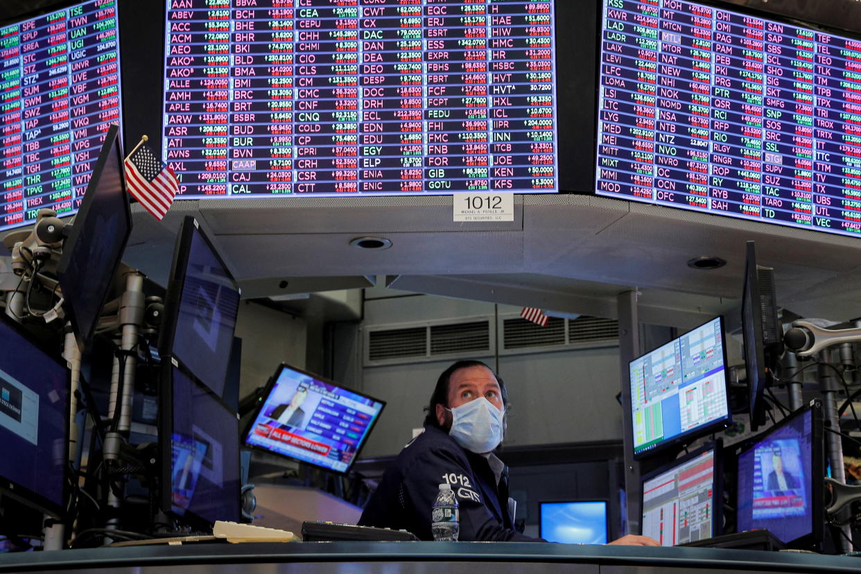 A specialist trader works inside a booth on the floor of the New York Stock Exchange (NYSE) in New York City, U.S., January 18, 2022.  REUTERS/Brendan McDermid