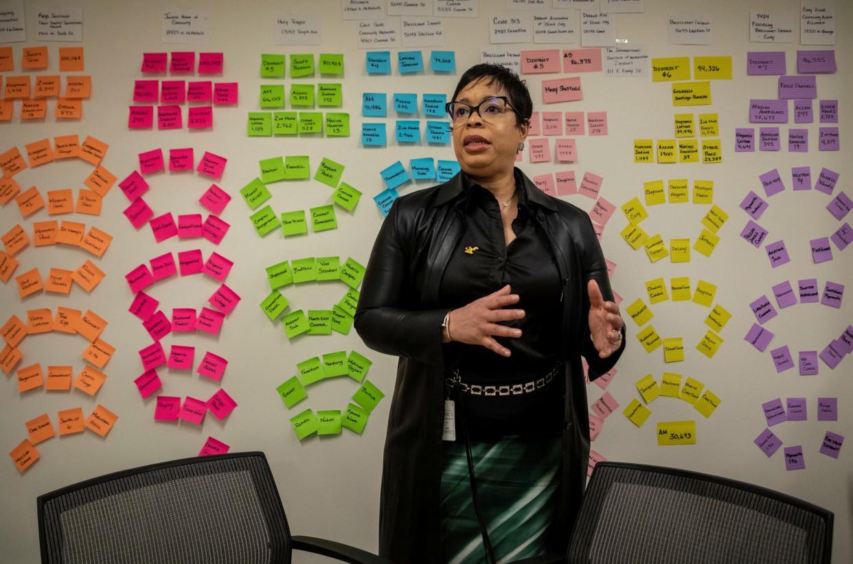 Detroit's Digital Equity Director Christine Burkette talks about closing the digital divide for the community of Detroit as she stands in front of her vision board inside the Department of Innovation & Technology at the Detroit Public Safety Headquarters on Wednesday, March 22, 2023.