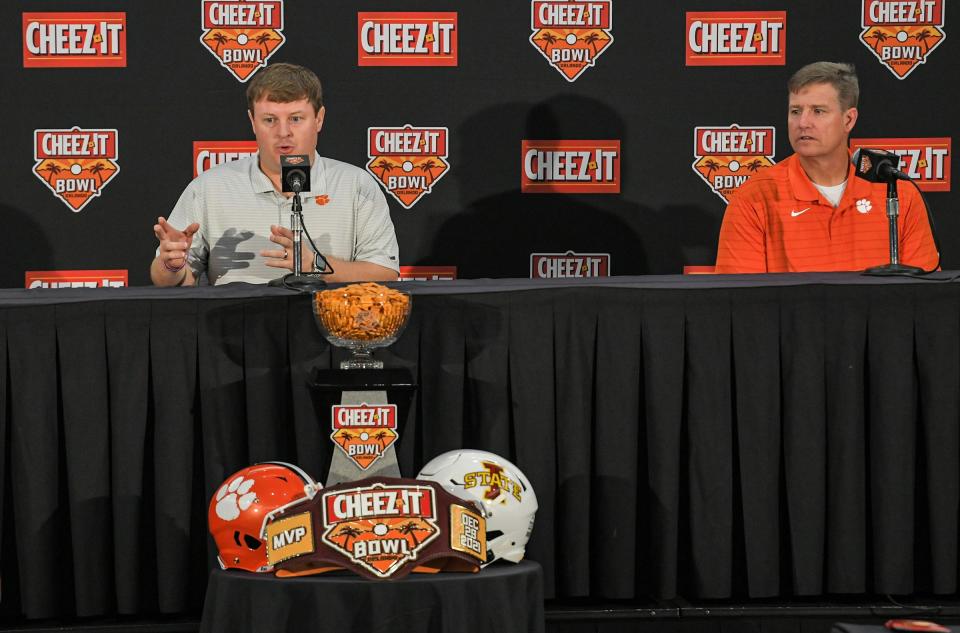 Clemson co-defensive coordinator Wes Goodwin, left, talks co-defensive coordinator Mickey Conn, right, during the 2021 Cheez-It Bowl press conference at the Rosen Plaza in Orlando, Florida Sunday, December 26, 2021.