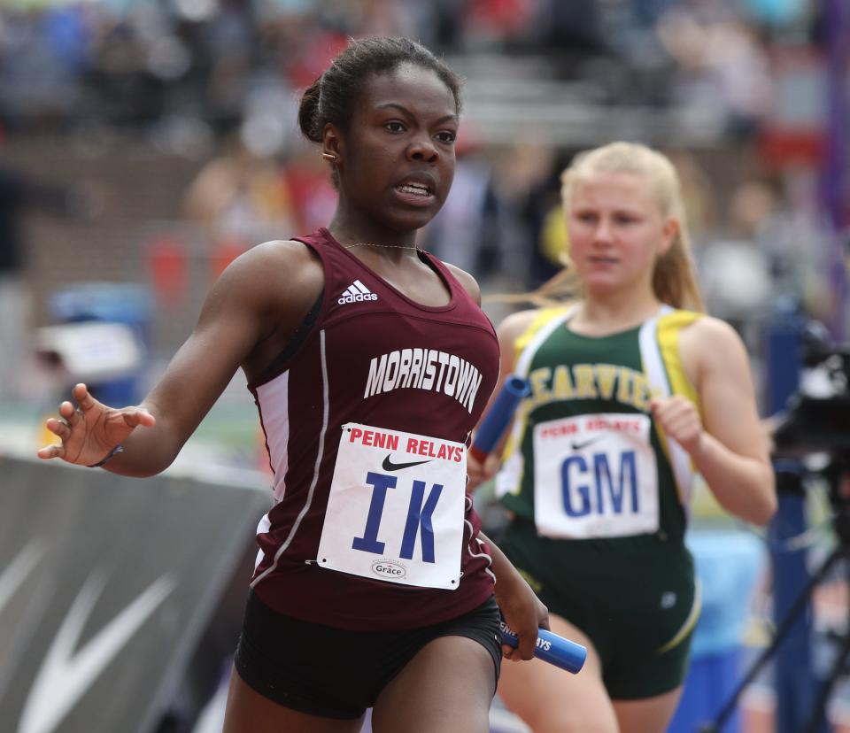 Jordan Robinson of Morristown finishes the girls 4 x 100 relay.