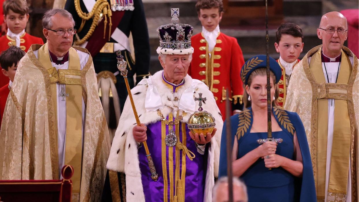  Britain's King Charles III wearing the Imperial state Crown, and carrying the Sovereign's Orb and Sceptre leaves Westminster Abbey after the Coronation Ceremonies in central London on May 6, 2023. 