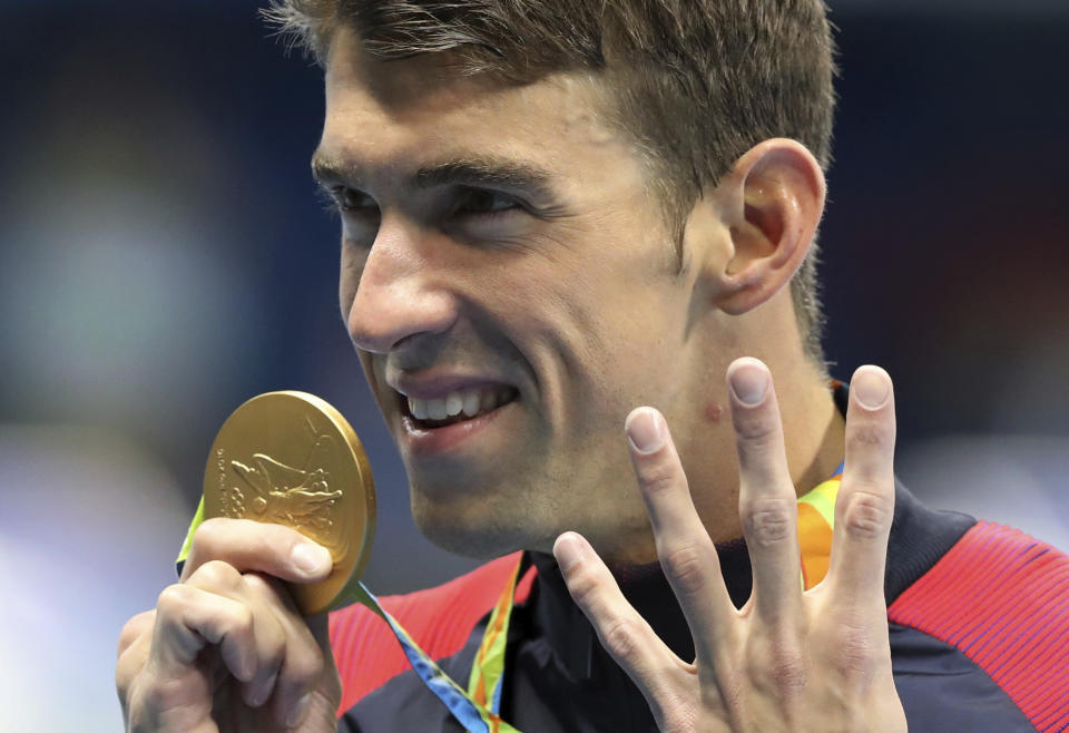 FILE - In this Aug. 11, 2016, file photo, United States' Michael Phelps celebrates winning the gold medal in the men's 200-meter individual medley during the swimming competitions at the Summer Olympics in Rio de Janeiro, Brazil. With the Tokyo Games on hold because of the coronavirus, the retired swimming great worries that some athletes may have trouble coping with this unprecedented postponement. “It's a total bamboozle,” Phelps told The Associated Press on Tuesday, March 24, 2020. “There's such a wave of emotions. I can't imagine what these athletes are going through right now.” (AP Photo/Lee Jin-man, File)