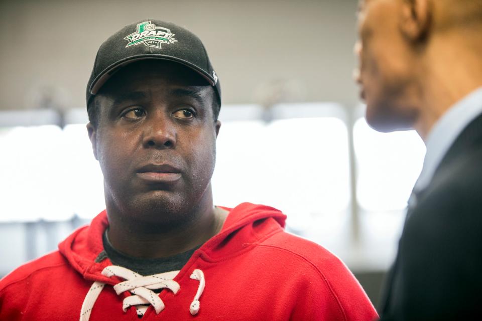 Mike Fox, owner of Detroit Thrive fitness, consults with a member of his legal team at his gym in Grosse Pointe Woods, Mich., Thursday, June 6, 2019.