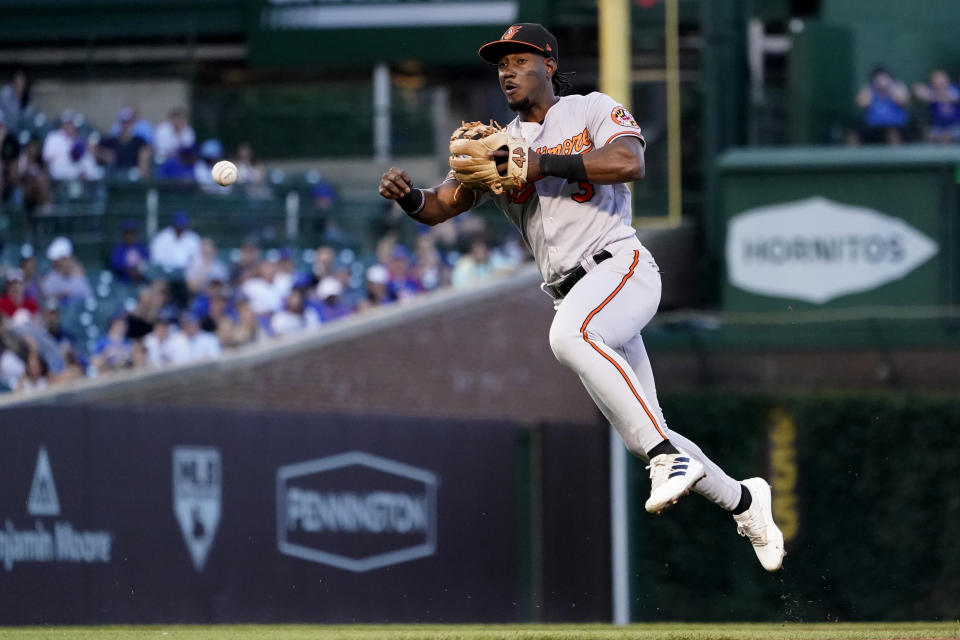 Baltimore Orioles shortstop Jorge Mateo throws out Chicago Cubs' Rafael Ortega at first, during the third inning of a baseball game Tuesday, July 12, 2022, in Chicago. (AP Photo/Charles Rex Arbogast)