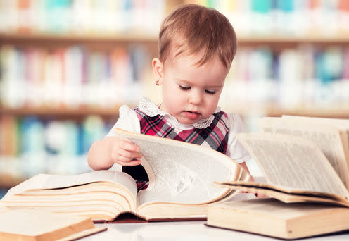 <span class="caption">Genes controlling how our nervous system develops are linked to intelligence.</span> <span class="attribution"><a class="link " href="https://www.shutterstock.com/image-photo/happy-cute-baby-girl-reading-book-186363857?src=pVwQngwPhJKzRnPpaDOdDQ-1-12" rel="nofollow noopener" target="_blank" data-ylk="slk:Evgeny Atamanenko;elm:context_link;itc:0;sec:content-canvas"> Evgeny Atamanenko</a></span>