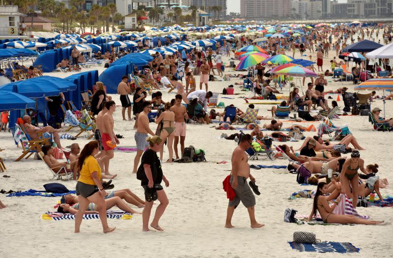 FILE PHOTO: People crowd the beach, while other jurisdictions had already closed theirs in efforts to combat the spread of novel coronavirus disease (COVID-19) in Clearwater
