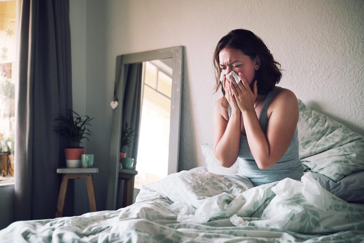 woman sick in bed