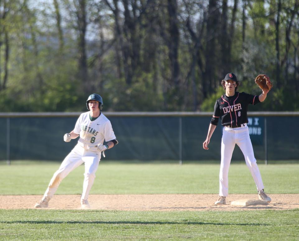 Spackenkill's Xavier Zykoff rounds second base past Dover's David Torrance during Friday's game on April 29, 2022.