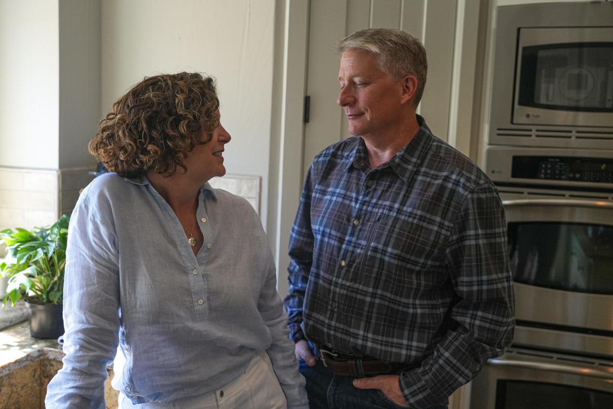 Kurt Zinsmeyer, with his wife, Jill, in the kitchen of their Lakeway home, has seen improvement since she joined a treatment study. "She had been pretty much housebound, and that is not the case anymore," he said.