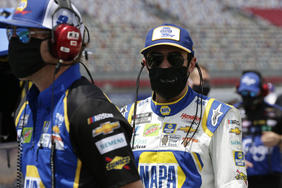 Driver Chase Elliott walks along pit road during qualifying prior to a NASCAR Cup Series auto race at Charlotte Motor Speedway Sunday, May 24, 2020, in Concord, N.C. (AP Photo/Gerry Broome)