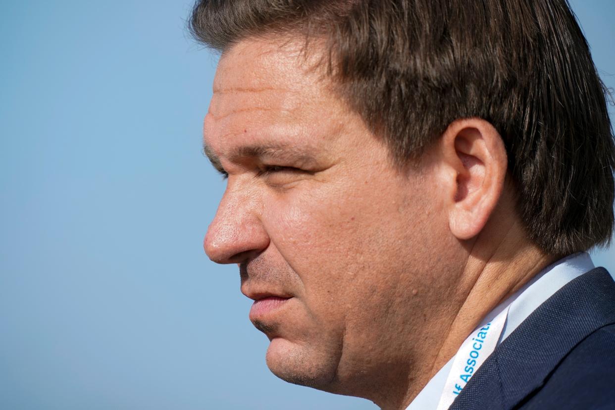<p>In this Saturday, May 8, 2021, file photo, Gov. Ron DeSantis, of Florida, watches the foursome matches during the Walker Cup golf tournament, in Juno Beach, Fla.</p> (AP)