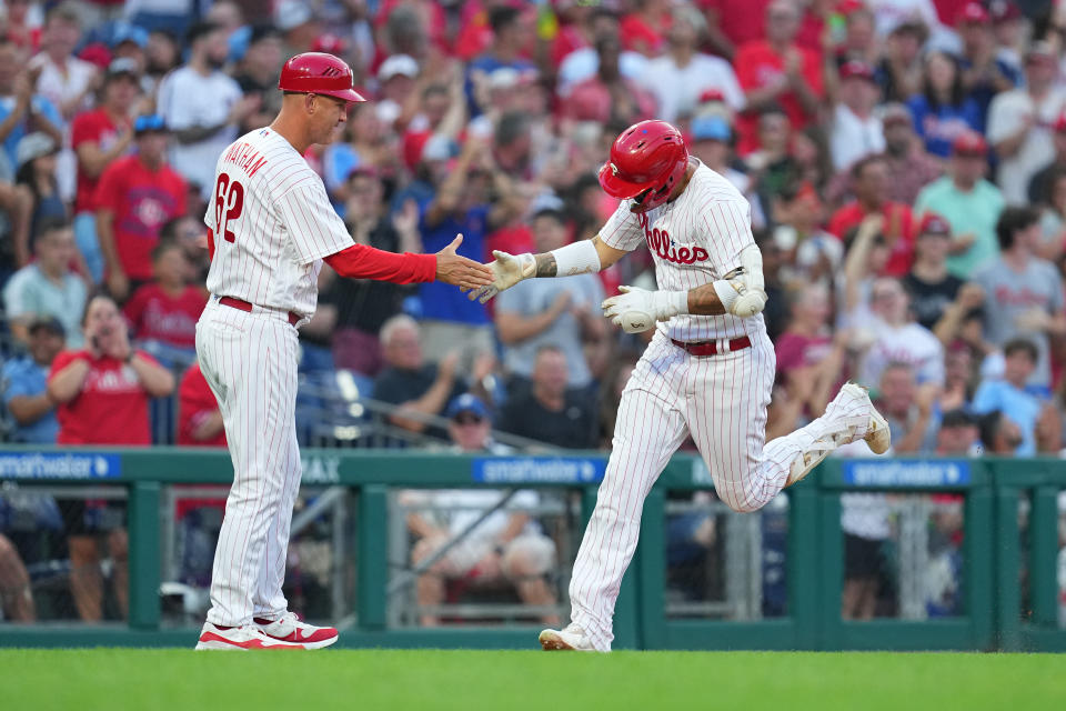 While coaching third-base comes with a lot of pressure, those in the role also get to enjoy a lot of post-home-run high-fives. (Mitchell Leff/Getty Images)