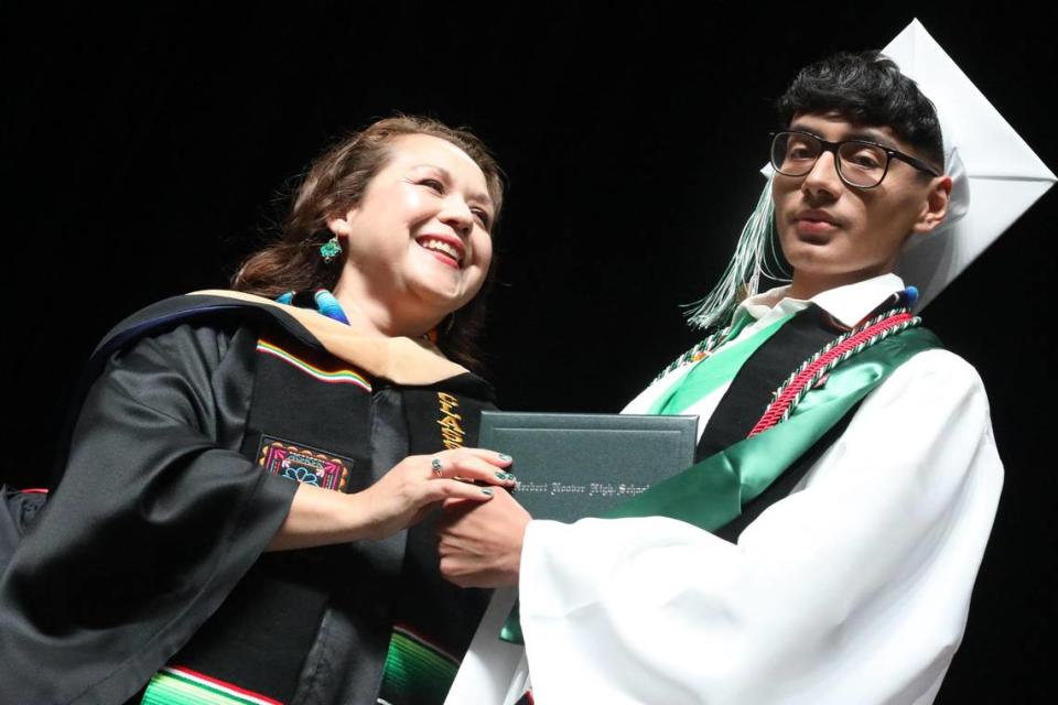 2023 Senior Class President Joseph Aquino gets his diploma from school board member Claudia Cazares during the Hoover High graduation ceremony held at the Save Mart Center on June 6, 2023. María G. Ortiz-Briones/mortizbriones@vidaenelvalle.com