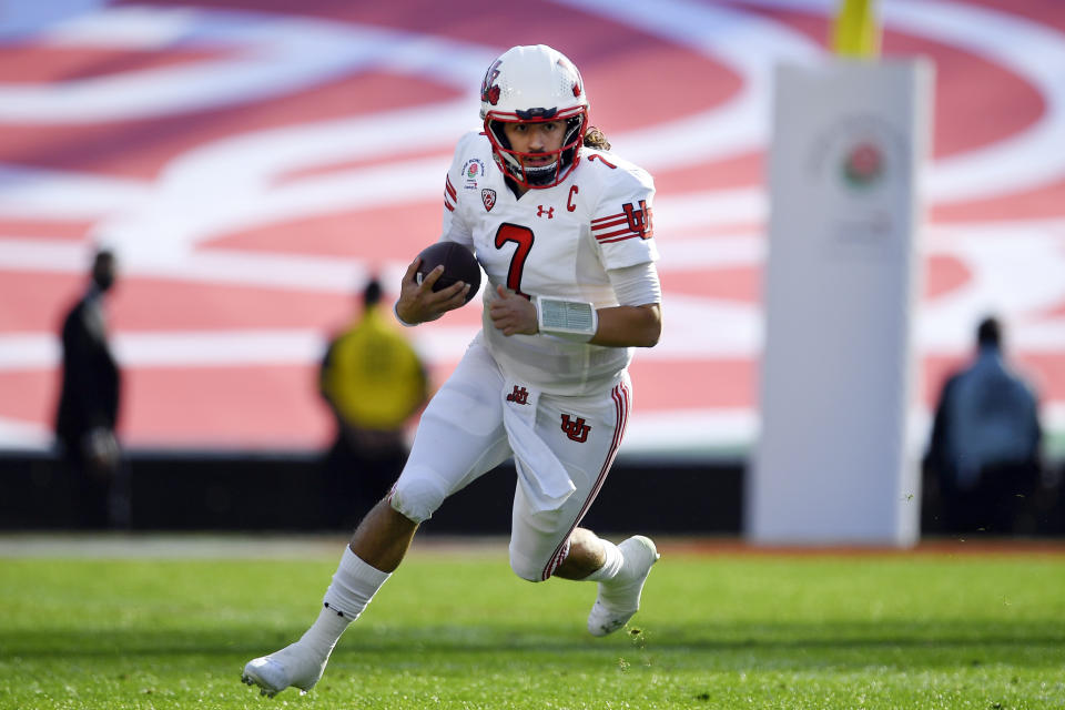 FILE - Utah quarterback Cameron Rising runs during the first half in the Rose Bowl NCAA college football game against Ohio State on Jan. 1, 2022, in Pasadena, Calif. Rising returns to the Utes after throwing for 2,493 yards and 20 touchdowns as a sophomore last season. Utah was picked to repeat as Pac-12 champions in the preseason media poll. (AP Photo/John McCoy, File)
