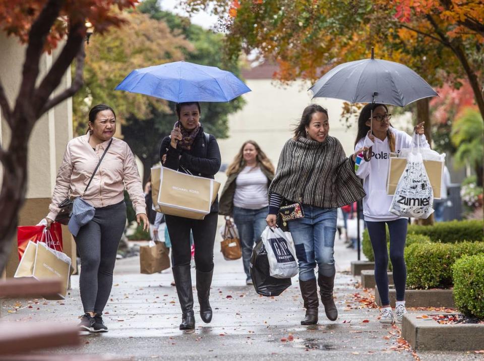 Shoppers look for Black Friday deals at the Folsom Premium Outlets on Friday, Nov. 23, 2018. Hector Amezcua