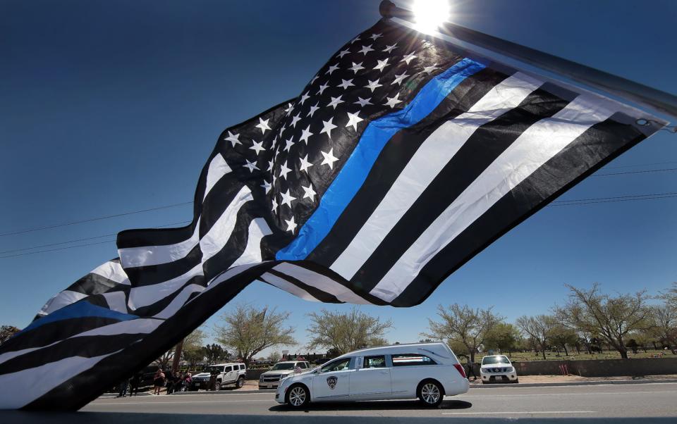 The hearse carrying El Paso County Sheriff's Deputy Peter J. Herrera's casket arrives at Evergreen Cemetery East for the slain deputy's graveside service Friday, March 29, 2019. Herrera, 35, died at a hospital Sunday, two days after being shot during a traffic stop in San Elizario, Texas. The suspect in the deputy's killing, Facundo Chavez, remains jailed on a capital murder charge.