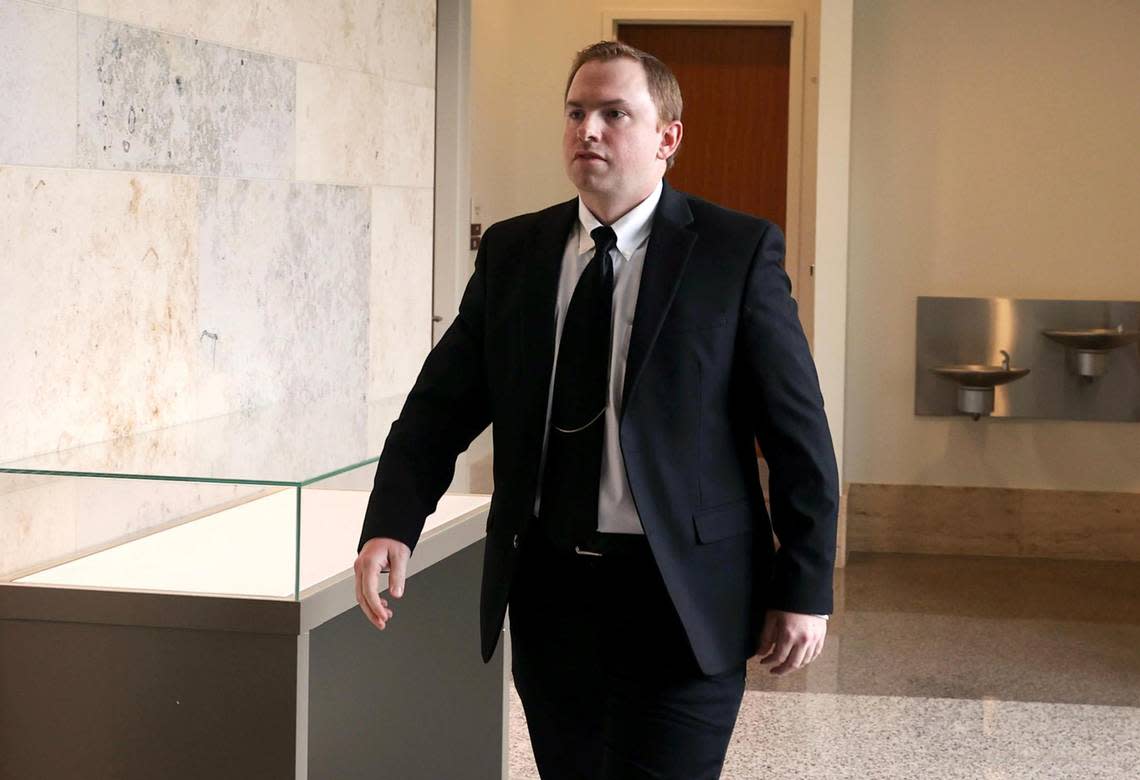 Aaron Dean, who is charged in the murder of Atatiana Jefferson, walks into the courtroom following a break in the third day of a pre-trial hearing on May 4, 2022, in Fort Worth. Dean’s lawyers were granted a delay in the trial.