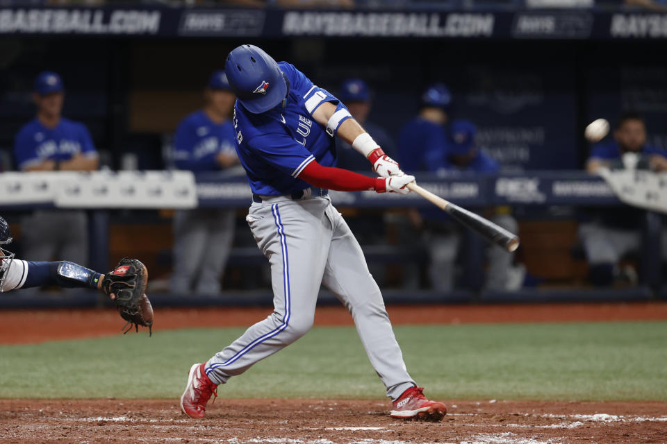 Toronto Blue Jays' Whit Merrifield hits a three-run home run against the Tampa Bay Rays during the seventh inning of a baseball game Saturday, Sept. 24, 2022, in St. Petersburg, Fla. (AP Photo/Scott Audette)