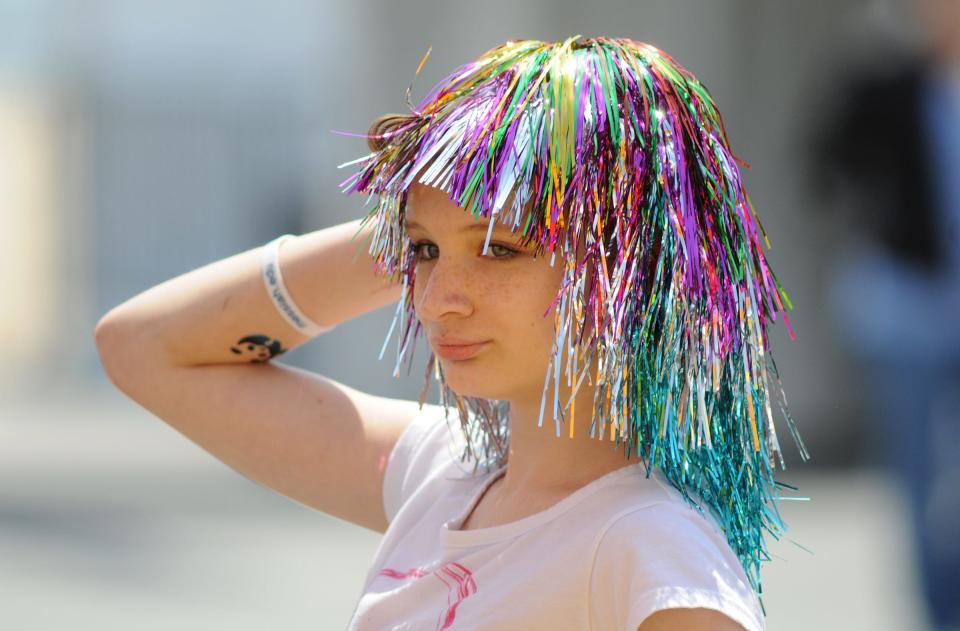 Makayla Harvey, 12, of Mechanicsburg, Pa., poses for a photo with a wig on during Springfest 2014 in Ocean City.