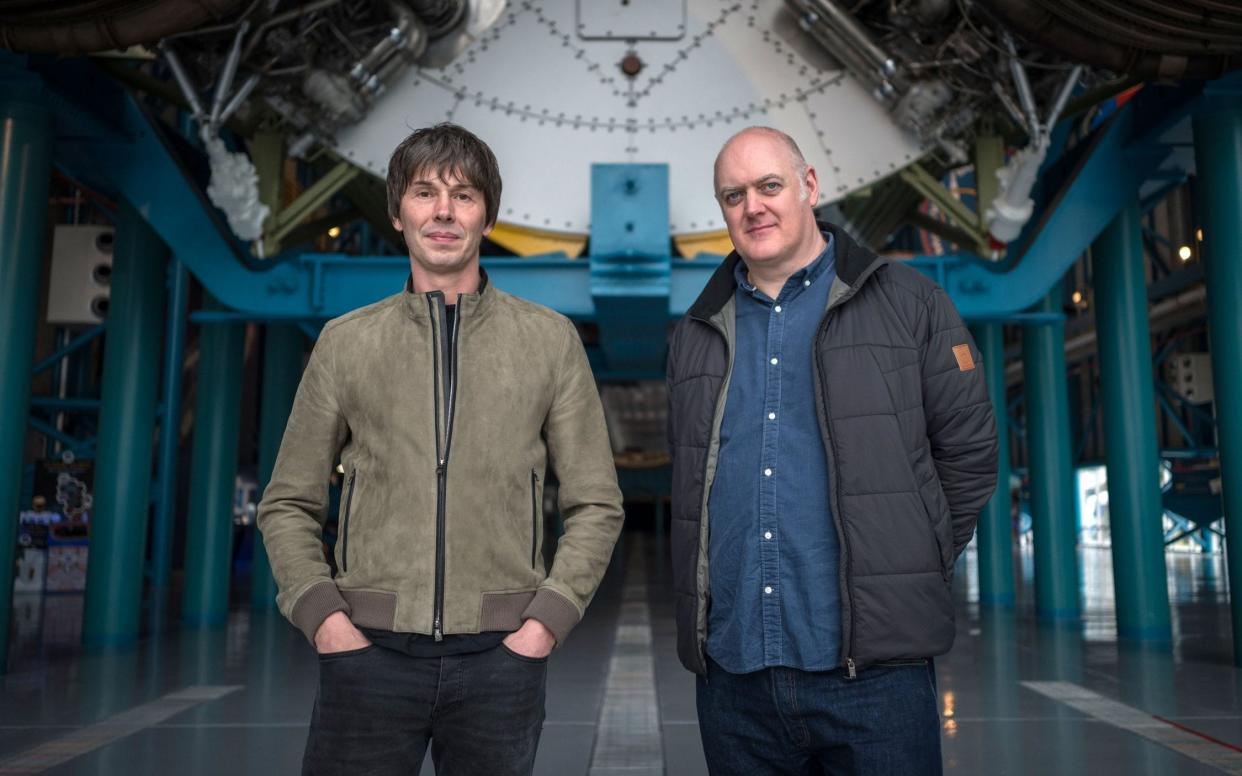 Professor Brian Cox and Dara Ó Briain in front of a Saturn V rocket - WARNING: Use of this copyright image is subject to the terms of use of BBC Pictures' Digital Picture Service (BBC Pictures) as set out at www.bbcpictures.co.uk. In particular, this image may only be published by a registered User of BBC Pictures for editorial use for the purpose of publicising the relevant BBC programme, personnel or activity during the Publicity Period which ends three review weeks following the date of transmission and provided the BBC and the copyright holder in the caption are credited. For any other purpose whatsoever, including advertising and commercial, prior written approval from the copyright holder will be required.