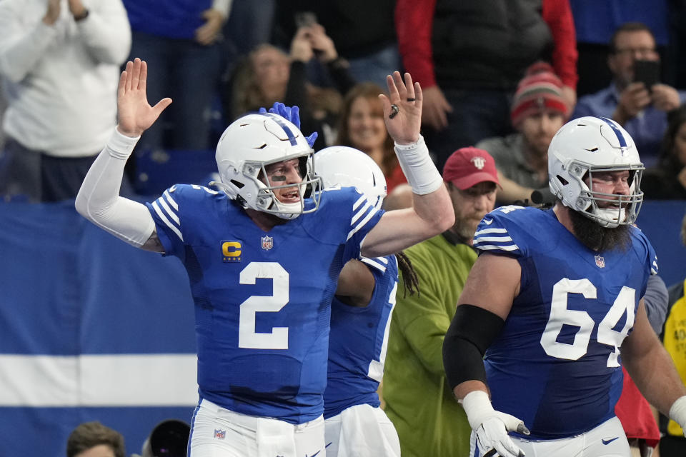 Indianapolis Colts quarterback Carson Wentz (2) reacts after throwing a touchdown to Indianapolis Colts' T.Y. Hilton during the first half of an NFL football game against the Tampa Bay Buccaneers, Sunday, Nov. 28, 2021, in Indianapolis. (AP Photo/AJ Mast)