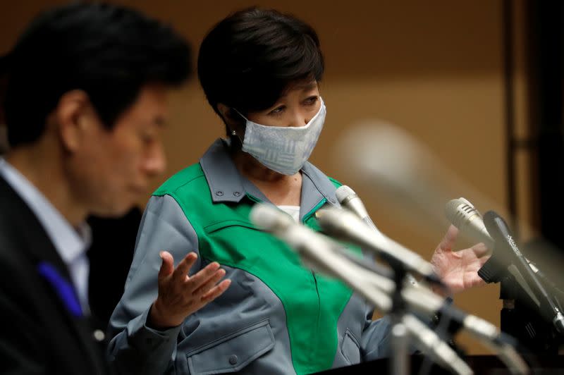 Tokyo Governor Yuriko Koike attends a joint news conference with Japan's Economy Minister Yasutoshi Nishimura in Tokyo