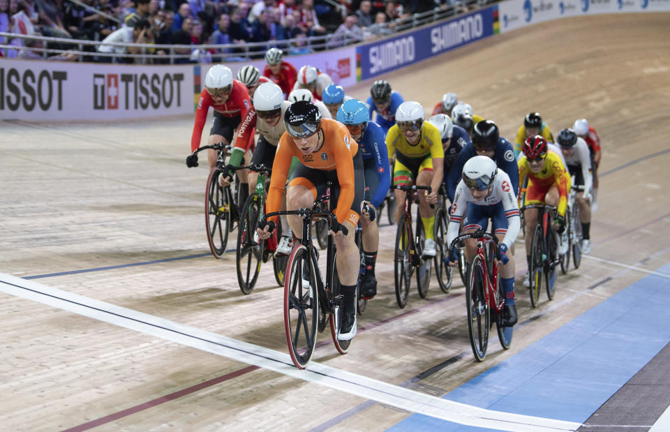 Kirsten Wild from the Netherlands leads the pack across the line during the World Championships Scratch women's track cycle race in Berlin, Germany, Wednesday Feb. 26, 2020. Wild won the event. (Sebastian Gollnow/dpa via AP)