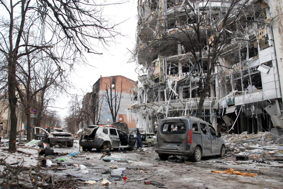 Cars and buildings destroyed by shelling 