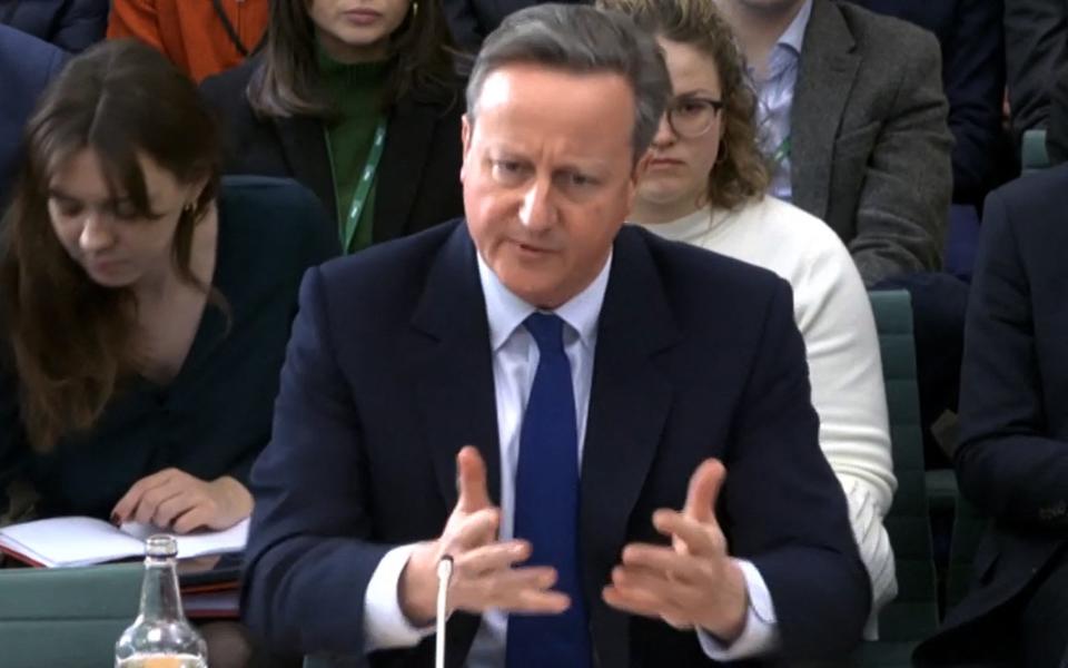 Lord Cameron, the Foreign Secretary, is pictured giving evidence to the Foreign Affairs Select Committee this afternoon