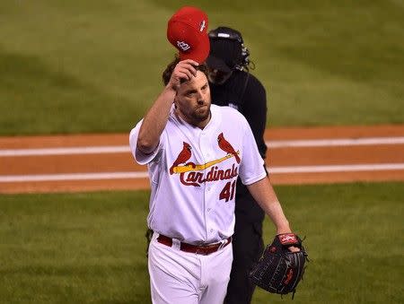 Oct 9, 2015; St. Louis, MO, USA; St. Louis Cardinals starting pitcher John Lackey (41) waves to fans after being pulled in the eighth inning of game one of the NLDS against the Chicago Cubs at Busch Stadium. Mandatory Credit: Jasen Vinlove-USA TODAY Sports