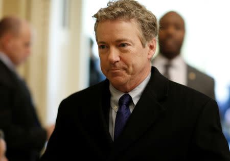FILE PHOTO: Senator Rand Paul (R-KY) walks from Senate Republican weekly policy luncheon on Capitol Hill in Washington, U.S., March 6, 2018. REUTERS/Joshua Roberts