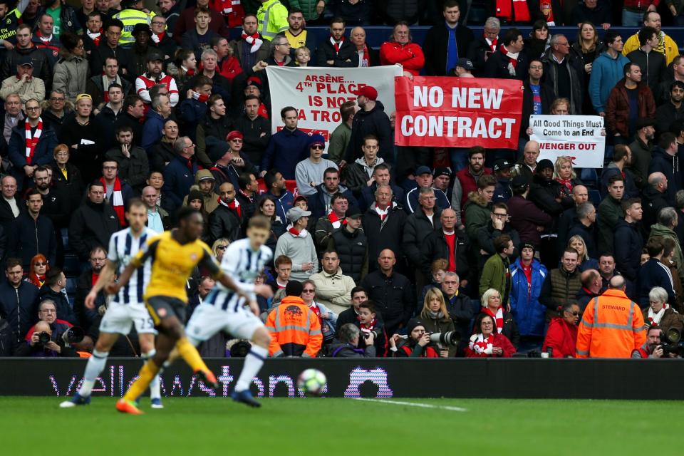 Arsenal fans display banners during the Premier League match between West Bromwich Albion and Arsenal at The Hawthorns 