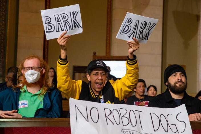 Los Angeles, CA - March 07: Audience member voices opposition to the donation of an unmanned quadruped vehicle 