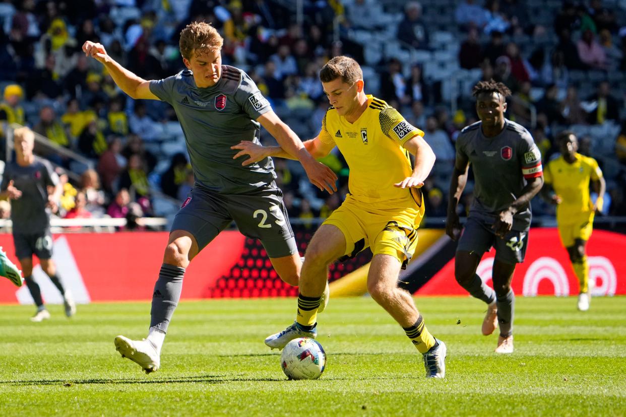 Oct 8, 2022; Columbus, Ohio, USA; Columbus Crew 2 Sean Zawadzki (25) dribbles past St. Louis CITY2 Max Schneider (23) during the first half of the MLS NEXT Pro Cup Championship at Lower.com Field. Mandatory Credit: Adam Cairns-The Columbus Dispatch