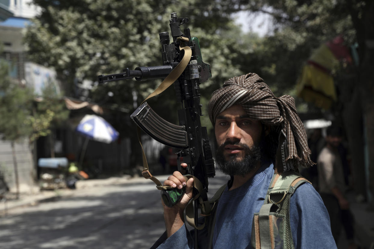 A Taliban fighter mans a checkpoint in the Wazir Akbar Khan neighborhood in Kabul, on Aug. 18, 2021.