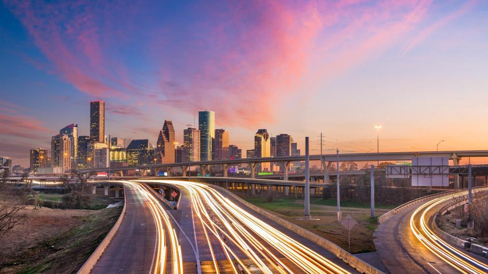 Houston, Texas, USA downtown skyline over the highways at dusk.