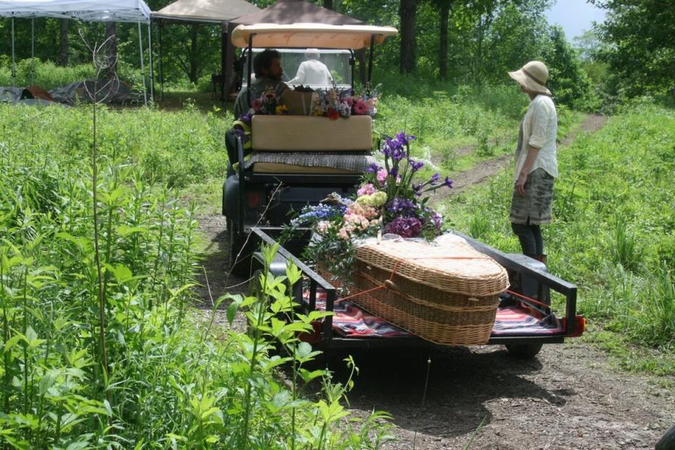 A biodegradable casket is taken for burial at the Carolina Memorial Sanctuary in Mills River, North Carolina (conservationburialalliance.org)