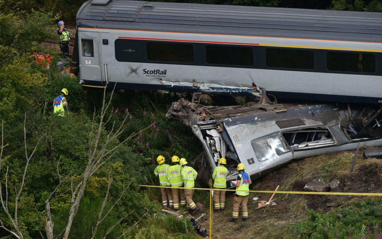 Emergency services inspect the scene near Stonehaven, Aberdeenshire - Ben Birchall/PA