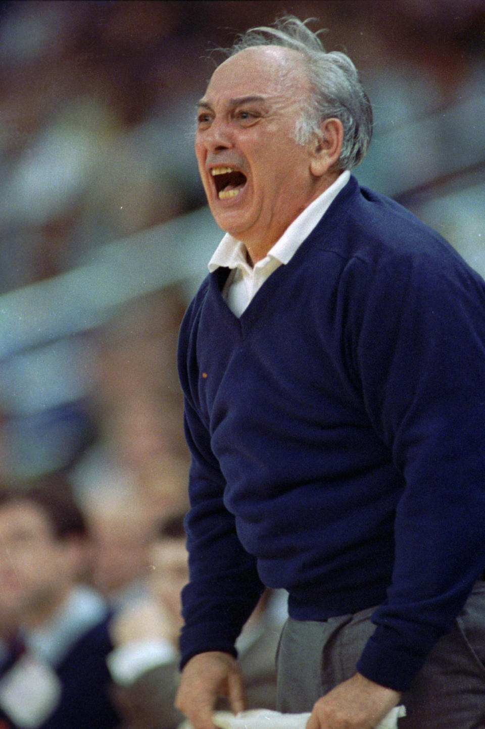 FILE - Princeton coach Pete Carril reacts as the team starts to lose a lead over Georgetown during a first-round game in the NCAA men's college basketball tournament March 17, 1989, in Providence, R.I. Georgetown defeated Princeton 50-49. Carril, the rumpled, cigar-smoking basketball coach who led Princeton to 11 appearances in the NCAA tournament, where his teams unnerved formidable opponents and rattled March Madness with old-school fundamentals, died Monday, Aug. 15, 2022. He was 92. (AP Photo/David Tennenbaum, File)