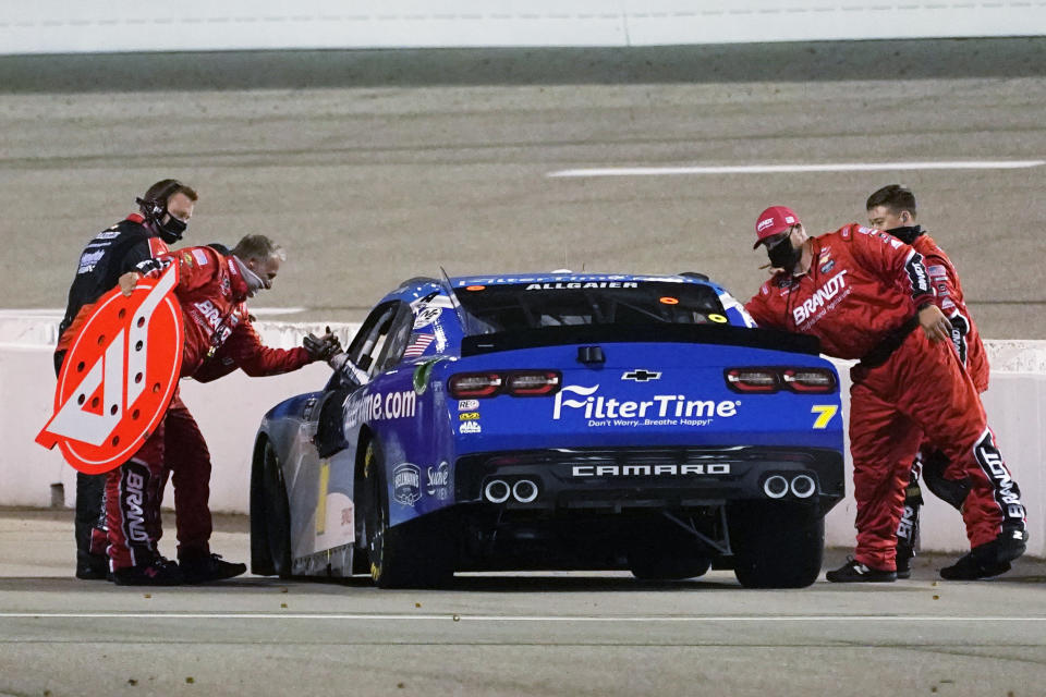 Justin Allgaier (7) greets his pit crew as he celebrates after winning a NASCAR Xfinity Series auto race Friday, Sept. 11, 2020, in Richmond, Va. (AP Photo/Steve Helber)