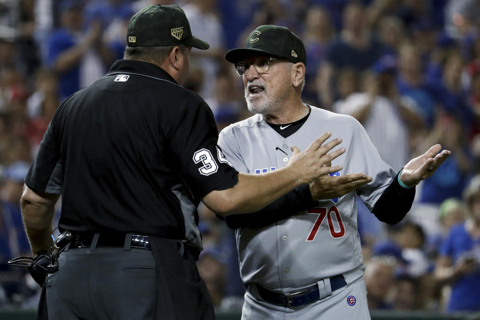 Chicago Cubs manager Joe Maddon argues with umpire Sam Holbrook (34) over the delivery of Washington Nationals relief pitcher Sean Doolittle during the ninth inning of a baseball game Saturday, May 18, 2019, in Washington. Maddon thought Doolittle was using an illegal delivery. Maddon believed the left-handed Doolittle was tapping his right toe on the ground before coming to the plate. The Nationals won 5-2. (AP Photo/Andrew Harnik)