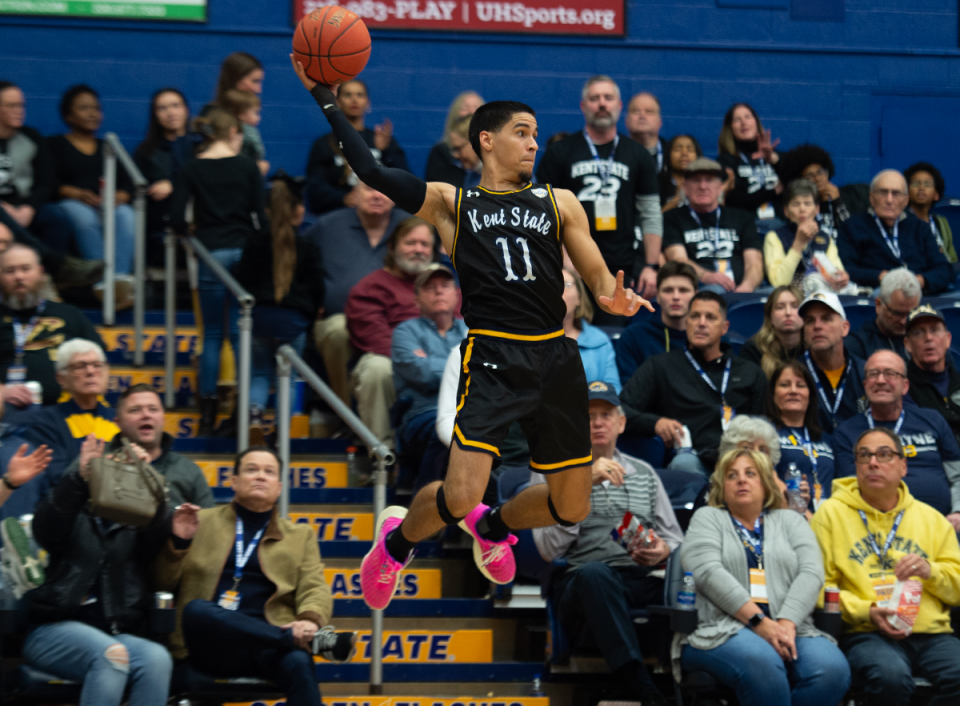 Giovanni Santiago saves a ball going out of bounds and passes to a teammate on Jan. 20