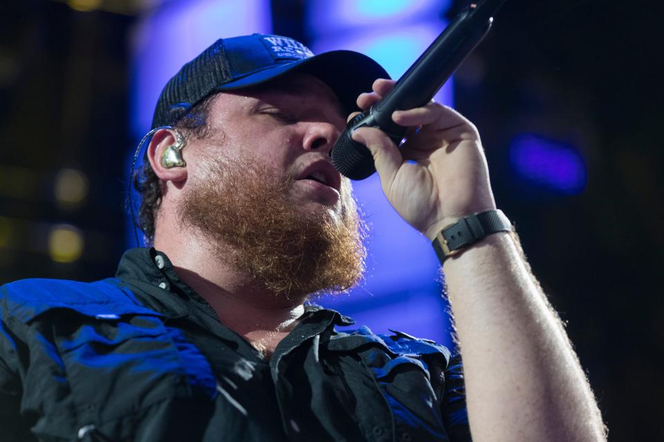 Country star Luke Combs, shown performing at Farm Aid at Alpine Valley Music Theatre in East Troy, will headline two concerts this weekend at American Family Field in Milwaukee.