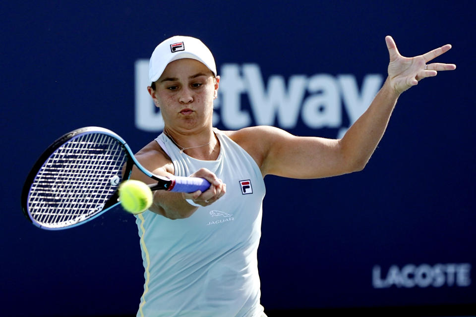 Ashleigh Barty, of Australia, returns to Elina Svitolina, of Ukraine, during the semifinals of the Miami Open tennis tournament, Thursday, April 1, 2021, in Miami Gardens, Fla. (AP Photo/Lynne Sladky)