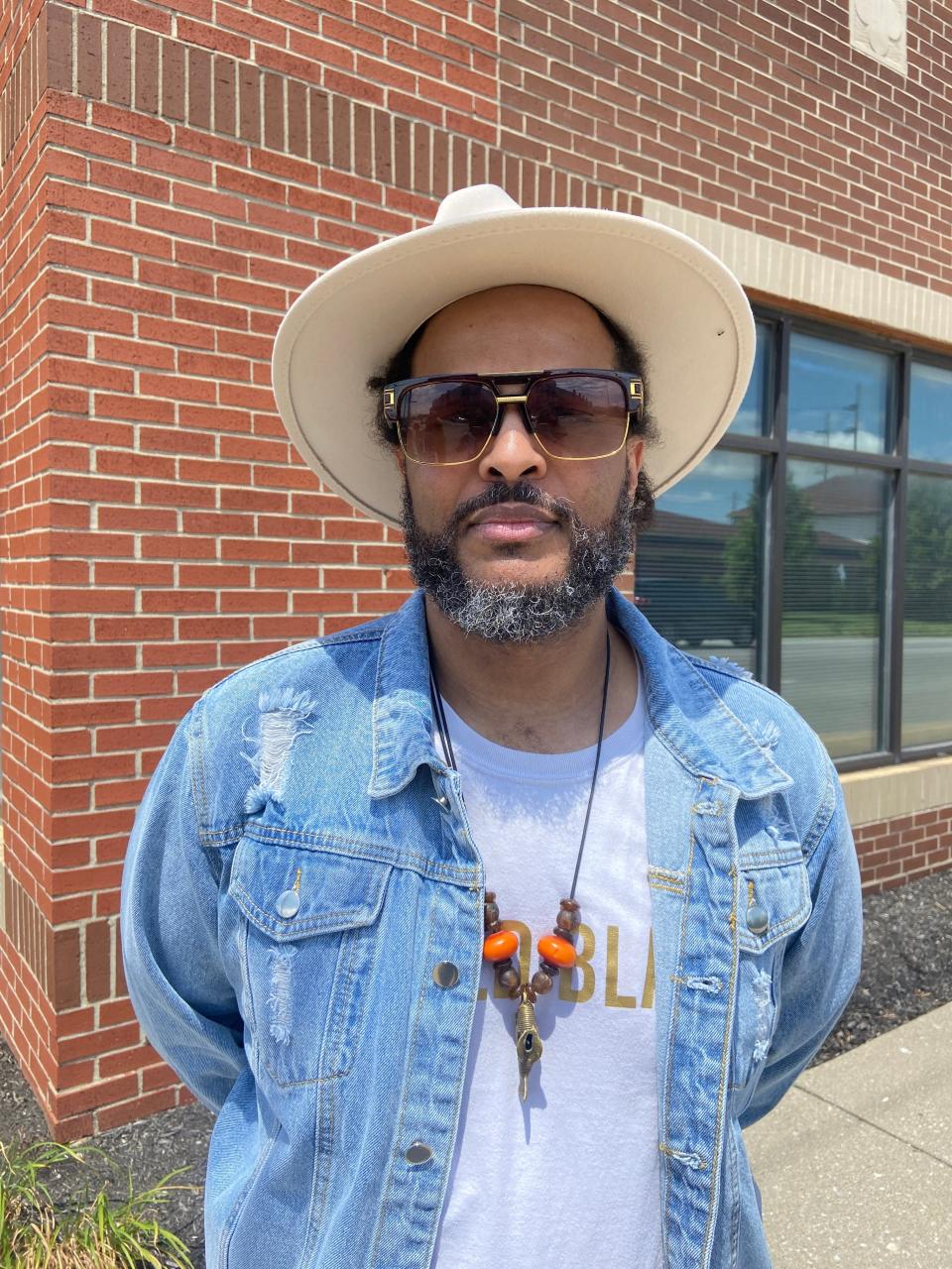 Charles Foster Jolivette, Andrew Foster's grandson, stands in front of the property where Foster Hotel once stood. He submitted the application for a historical marker to honor his grandfather, which was unveiled on July 8, 2023.