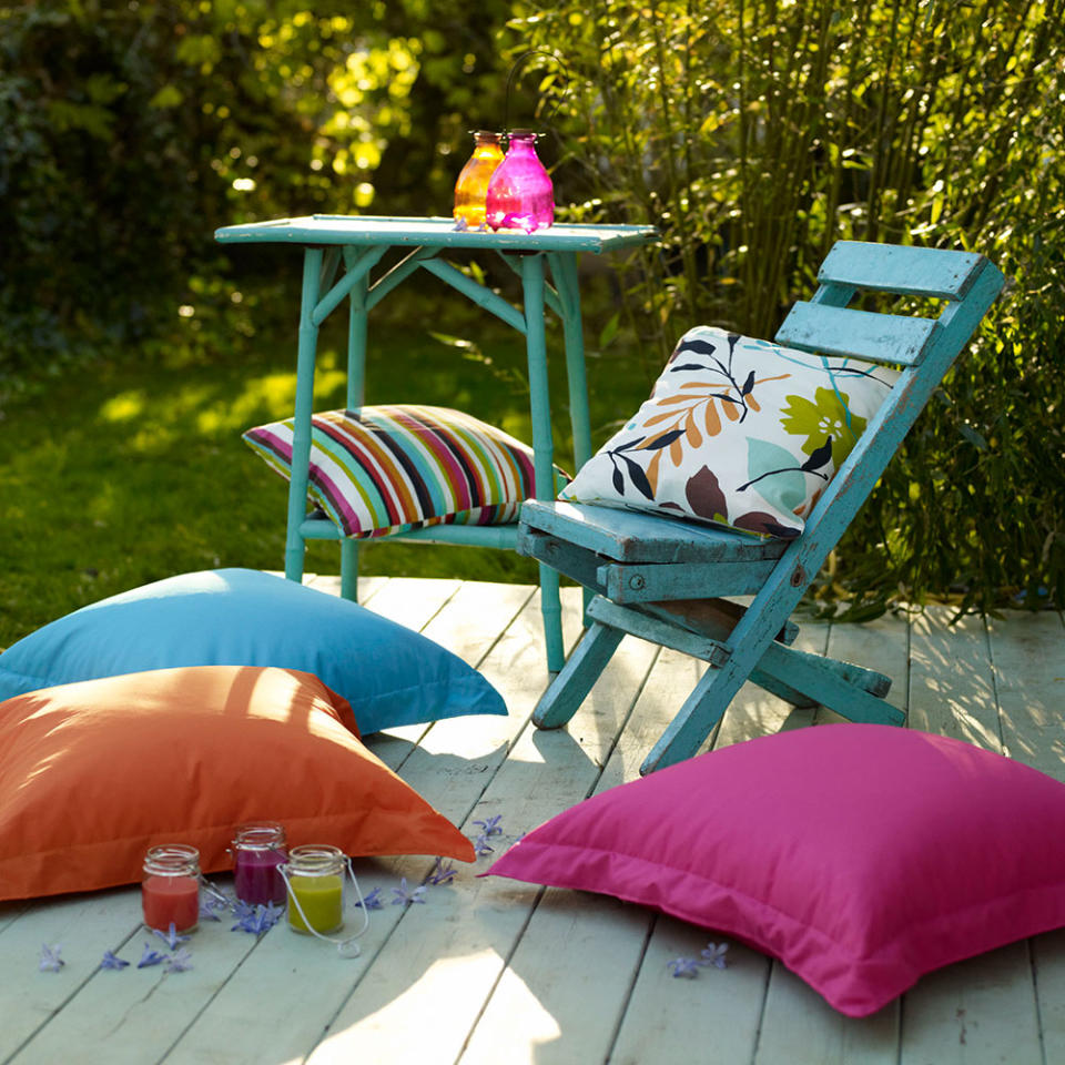 <p> Give a small decking area some special treatment. Block-coloured brights in various complementary hues are sure to make an impact. If you have wooden furniture you're thinking of getting rid of, a coat of paint will give it a new look and repurpose it for the garden. Do make sure to choose a weather-resistant finish, though. </p> <p> A hit of bold colour is great way to enhance small garden ideas, to make more of a statement with a tiny space. </p>