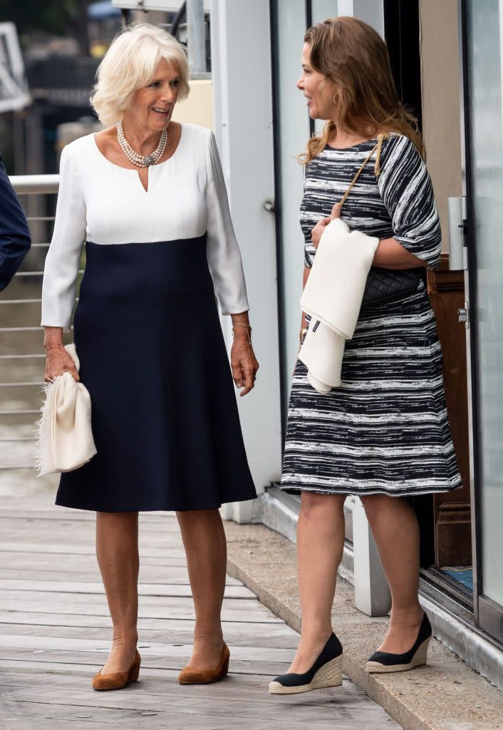 <p>The Duchess of Cornwall wore a sleek navy blue and white color-blocked dress while visiting the Maiden yacht in London with Princess Haya Bint Al Hussein and Prince Charles. </p>