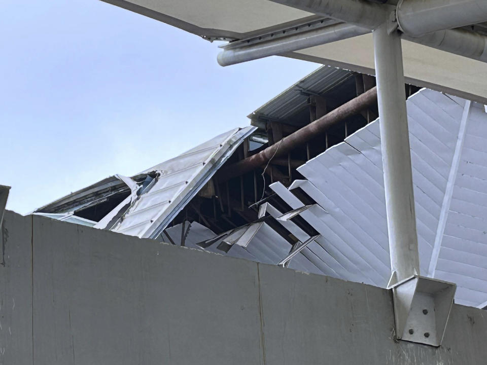 A view of the damage to a part of a departure terminal canopy at New Delhi’s Indira Gandhi International Airport that collapsed in heavy pre-monsoon rains in New Delhi, India, Friday, June 28, 2024. (AP Photo/Shonal Ganguly)
