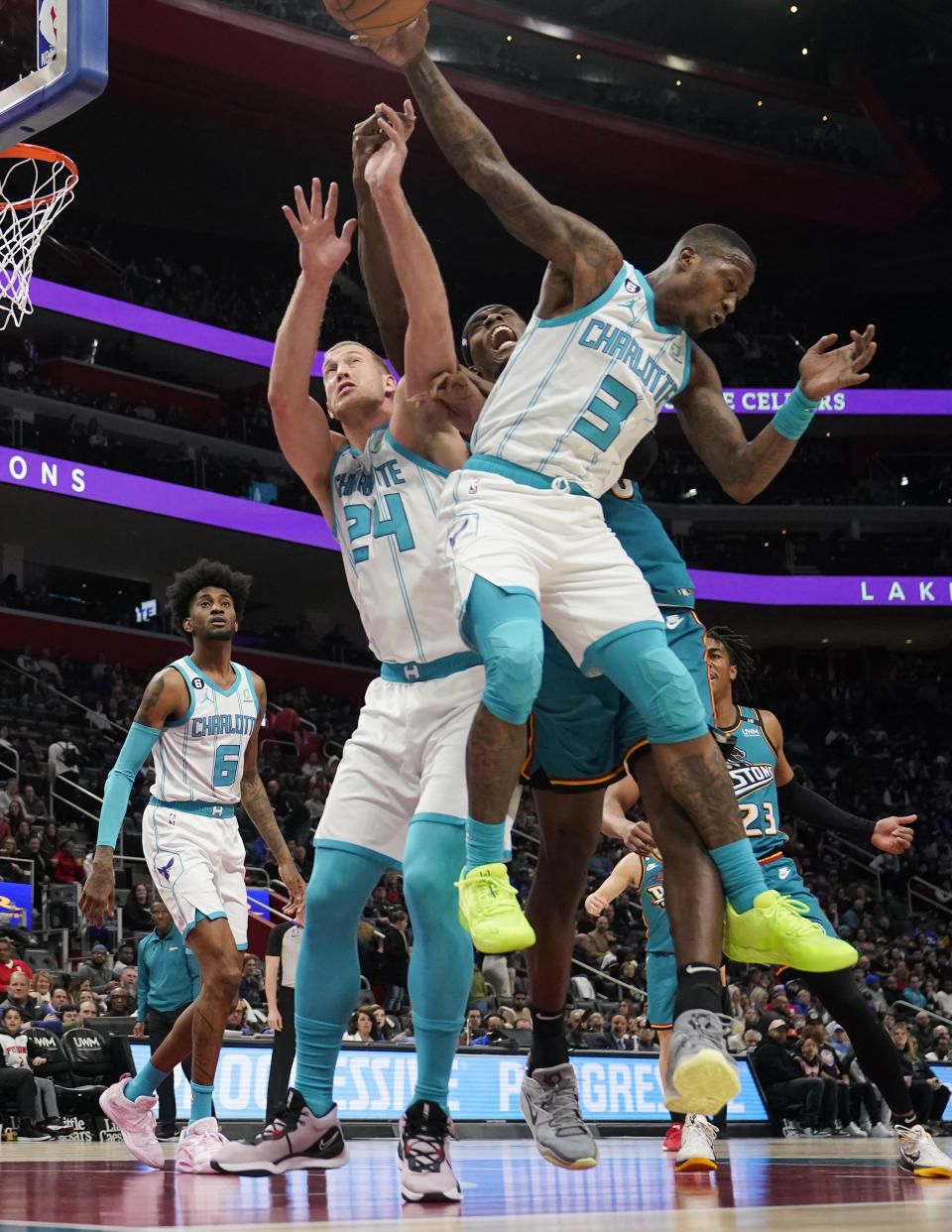 Charlotte Hornets center Mason Plumlee (24), guard Terry Rozier (3) and Detroit Pistons center Jalen Duren reach for the rebound during the first half of an NBA basketball game, Friday, Feb. 3, 2023, in Detroit. (AP Photo/Carlos Osorio)