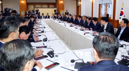 South Korean President Moon Jae-in speaks during a meeting with executives from South Korea's top 30 conglomerates at the Presidential Blue House in Seoul